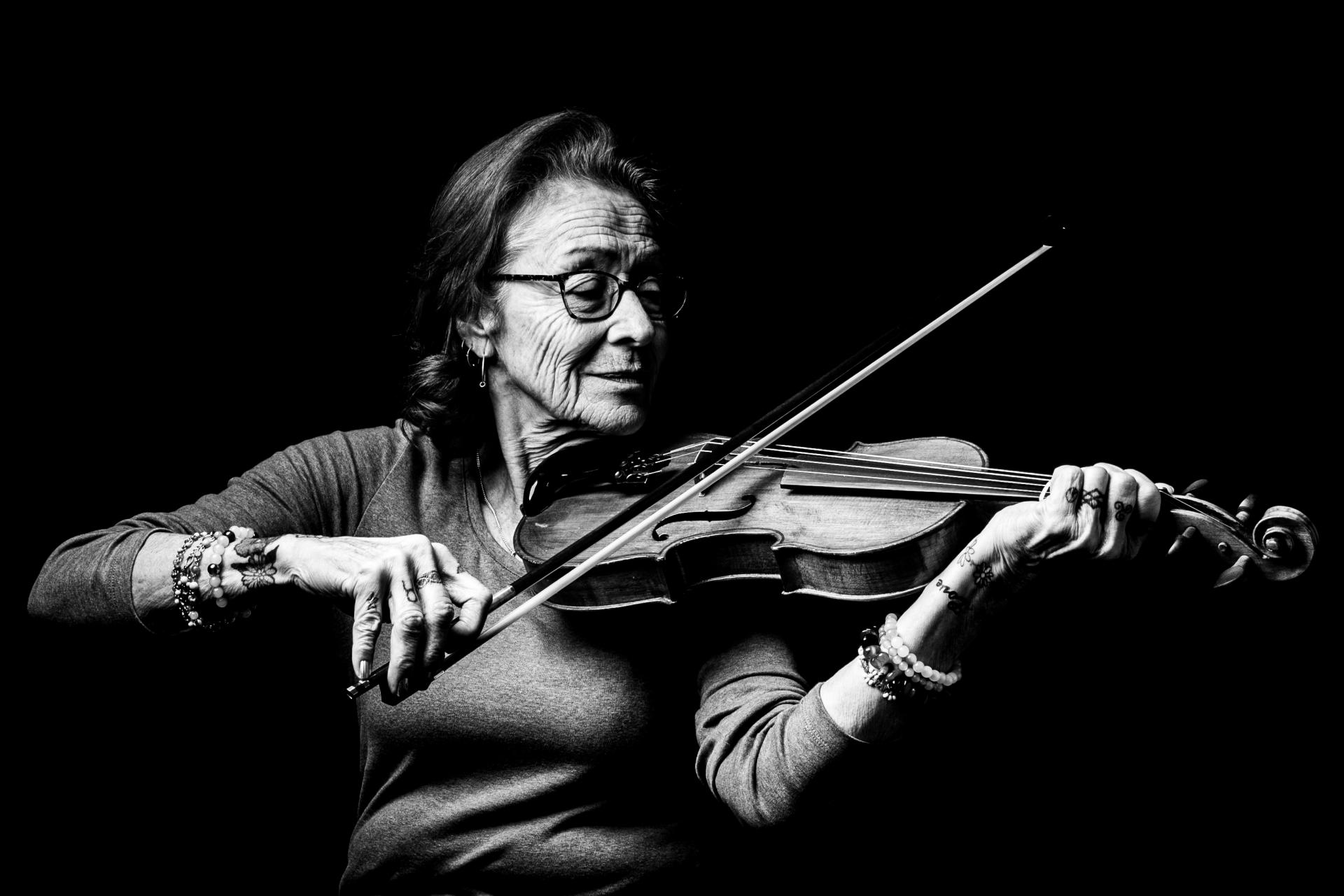 London Photography Awards Winner - Metis woman learning to play the fiddle